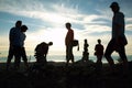 Silhouette of group of people at top of mountain Royalty Free Stock Photo