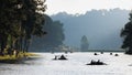 Silhouette group of tourists are rafting in morning sunlight at reservoir Pang Ung landmark mea hong son province, Thailand