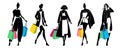 Silhouette of group of women holding shopping bags