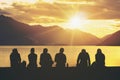 Silhouette Group of Young People Sitting on Beach