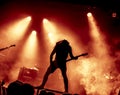 Silhouette of guitar player in action on stage Royalty Free Stock Photo