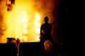 Silhouette of guitar player, guitarist perform on concert stage.