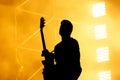 Silhouette of guitar player, guitarist perform on concert stage.