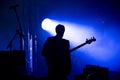 Silhouette of a guitar player on the stage Royalty Free Stock Photo