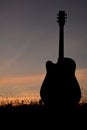 Silhouette guitar at the sky sunset Royalty Free Stock Photo