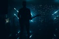 silhouette of a guitarist on a dramatic illuminated dark stage with a guitar night life concert rock Royalty Free Stock Photo