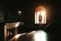 Silhouette of a guy standing near the window in a Genoese fortress in Sudak Crimea Stone walls of an ancient castle Royalty Free Stock Photo