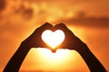 Silhouette Hand Heart at Sunrise and Sunset Royalty Free Stock Photo