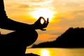 Silhouette, hand of Woman Meditating in Yoga pose or Lotus Posit Royalty Free Stock Photo