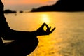 Silhouette, hand of Woman Meditating in Yoga pose or Lotus Posit Royalty Free Stock Photo