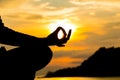 Silhouette, hand of Woman Meditating in Yoga pose or Lotus Posit Royalty Free Stock Photo