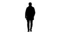 Silhouette Handsome man in fashionable clothes walking and smiling.