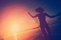 Silhouette of handsome woman dancing in the ocean at sunset Royalty Free Stock Photo