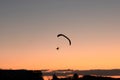 Silhouette of the hang glider that flying in the sky Royalty Free Stock Photo