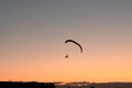 Silhouette of the hang glider that flying in the sky Royalty Free Stock Photo