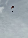 Silhouette of hangglider in sky