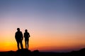 Silhouette of happiness family against beautiful colorful sky. S