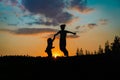 Silhouette of happy boy and girl enjoy sunset nature Royalty Free Stock Photo