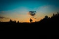 Silhouette of happy boy and girl run at sunset Royalty Free Stock Photo