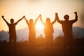 Silhouette of happy business human team making high hands over head in sunset sky evening time background for business teamwork Royalty Free Stock Photo