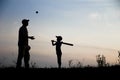 silhouette Happy child with parent playing baseball concept