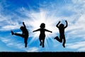 Silhouette happy children jumping