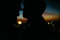 Silhouette of happy couple looking at each other and touching wi Royalty Free Stock Photo