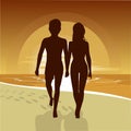 Silhouette of happy couple walking along beach at sunset