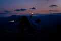 Silhouette of happy couplewhile dancing and holding burning sparkle against sunset sky Royalty Free Stock Photo