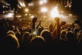 Silhouette of a happy crowd with hands up during a big rock concert Royalty Free Stock Photo