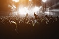 Silhouette of a happy crowd with hands up during a big rock concert Royalty Free Stock Photo