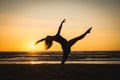 Silhouette of a happy dancer girl jumping the sunset Royalty Free Stock Photo