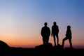 Silhouette of a happy family with arms raised up against beautiful sky. Summer Sunset Royalty Free Stock Photo