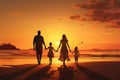 Silhouette of happy family on the beach at beautiful sunset, A happy family in walks hand in hand down a paradise beach during Royalty Free Stock Photo