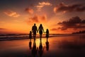 Silhouette of happy family on the beach at beautiful sunset, A happy family in walks hand in hand down a paradise beach during Royalty Free Stock Photo