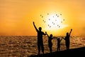 Silhouette of happy family on beach Royalty Free Stock Photo