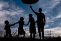 Silhouette of a happy family with children