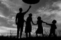 Silhouette of a happy family with children