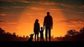 Silhouette of a Happy Family and Dog Against the Setting Sun Royalty Free Stock Photo