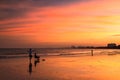 Silhouette happy family enjoy sunset at dusk on beach Royalty Free Stock Photo