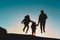 Silhouette of happy family enjoy travel at sunset Royalty Free Stock Photo