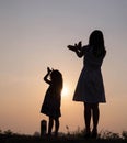 Silhouette of woman praying over beautiful sky background Royalty Free Stock Photo