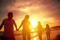 Silhouette of happy family walking on the beach Royalty Free Stock Photo