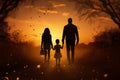 Silhouette happy family walking in a field at sunset Royalty Free Stock Photo