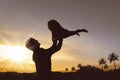 Silhouette of happy father and little girl playing together Royalty Free Stock Photo