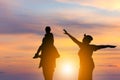 Silhouette of Happy father mother and daughter playing together outdoor, Cheerful family enjoying at sunset, Happiness family Royalty Free Stock Photo