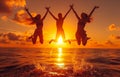 Silhouette of happy friends jumping on the beach on beautiful summer sunset Banque d& x27;images Royalty Free Stock Photo