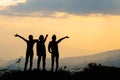 Silhouette of happy friends  in sunset sky evening time background,  Group of young people having fun on summer vacation,  Youth Royalty Free Stock Photo