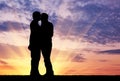 Silhouette happy gay kissing