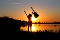 Silhouette of a happy girl with a guitar on the nature Royalty Free Stock Photo